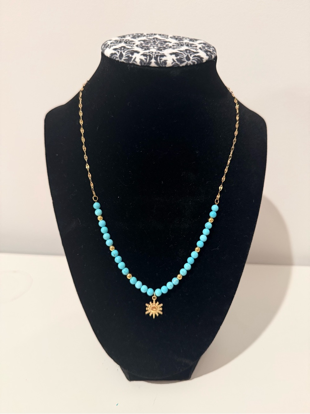 Turquoise Bead Necklace with Gold Sunburst Charm